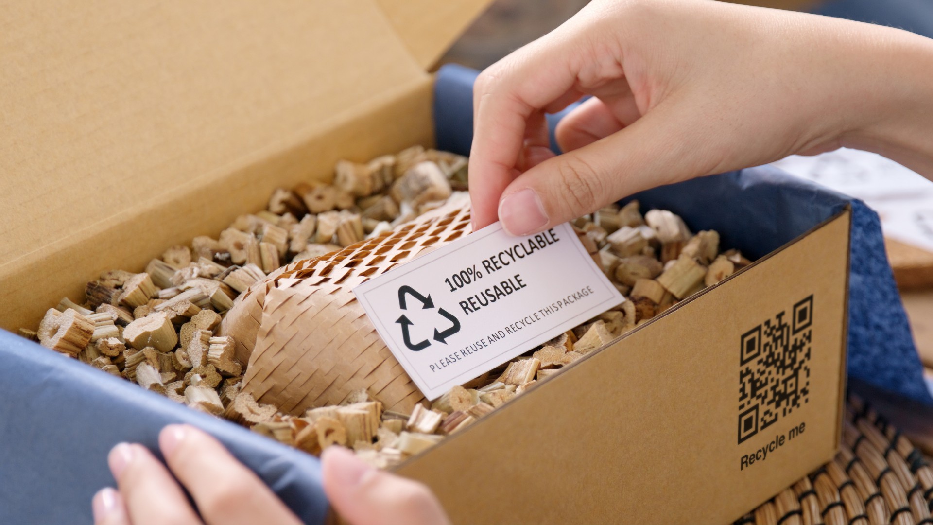 Hand holding a recycle card